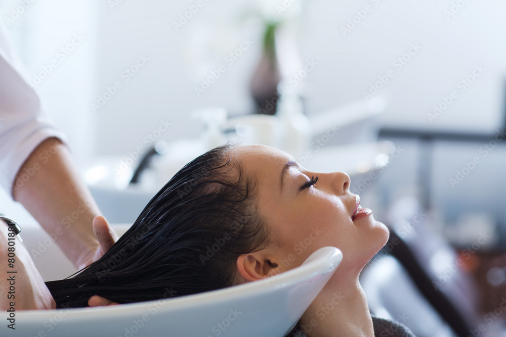 happy young woman at hair salon happy young woman at hair salon