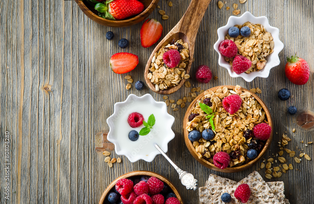 Fresh healthy breakfast with granola and berries, copy space bac Fresh healthy breakfast with granola and berries, copy space bac
