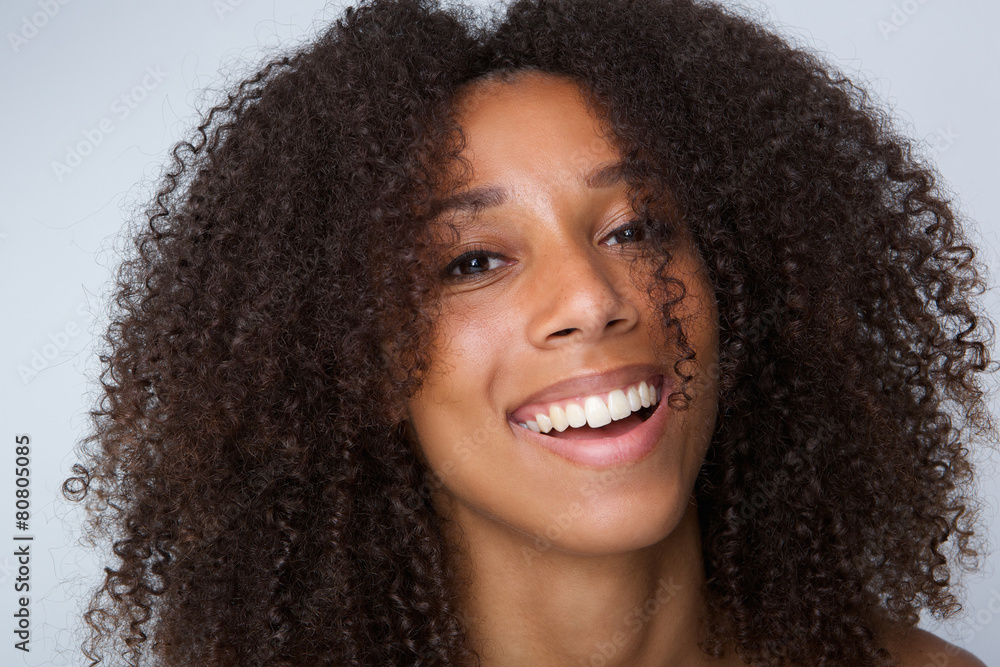 Happy african american woman with curly hair laughing Happy african american woman with curly hair laughing