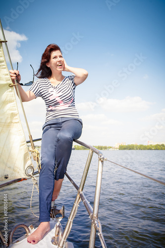 woman at the bow of the yacht