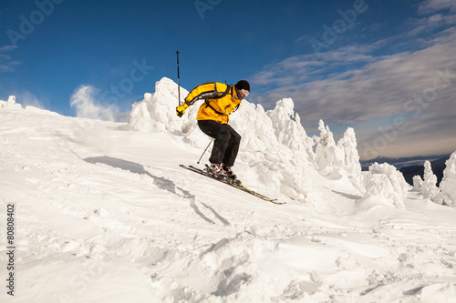 Man Snow Skiing Against Blue Sky