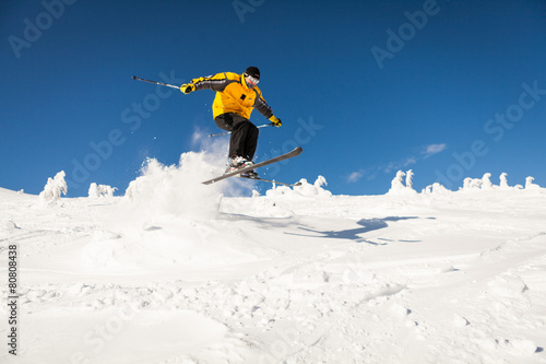 Man Snow Skiing Against Blue Sky