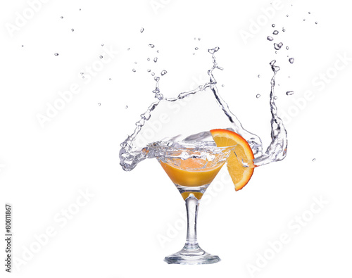 Orange or lemon slice fall in glass with water and make splash