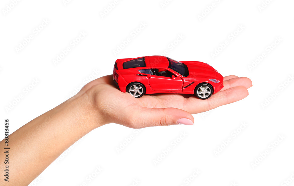 car in female hand isolated on white background car in female hand isolated on white background