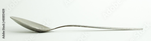 Metal and wood spoon in profile