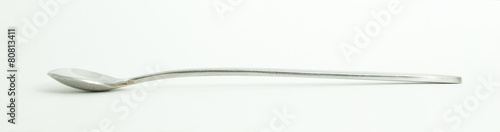 Metal and wood spoon in profile