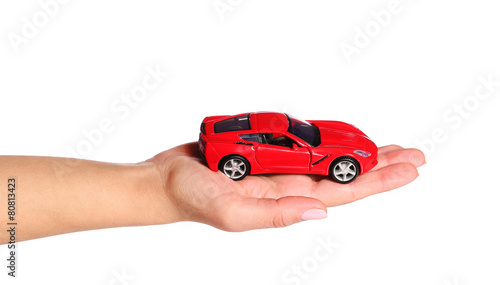 car in female hand isolated on white background