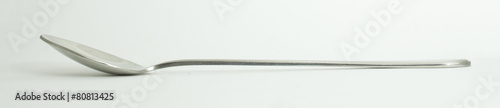Metal and wood spoon in profile
