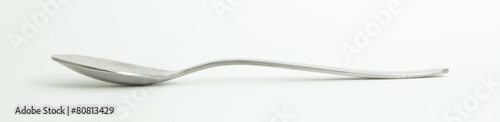 Metal and wood spoon in profile