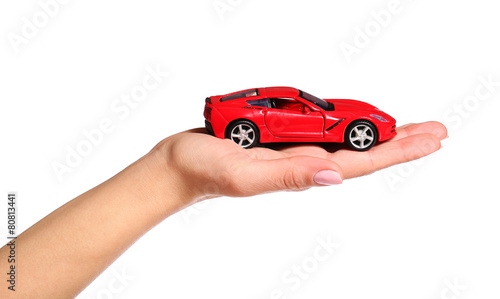 car in female hand isolated on white background