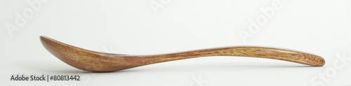 Metal and wood spoon in profile