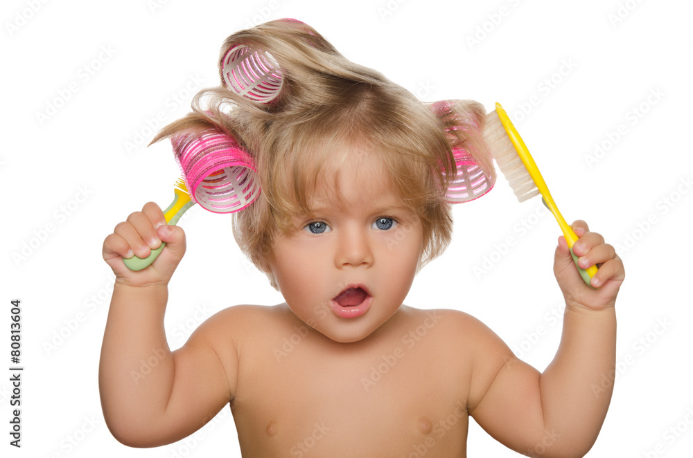 Little beautiful kid with hair curlers and comb Little beautiful kid with hair curlers and comb