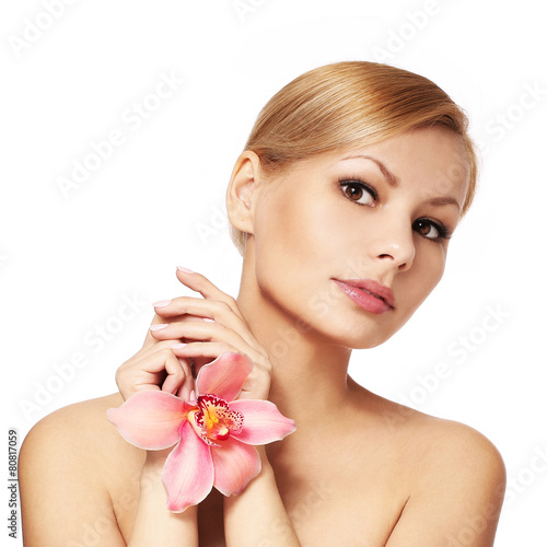 Beautiful young woman holding orchid flower  isolated on white