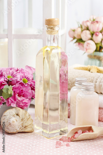 Spa set: bottle of essential oil, liquid soap, scoop of raspberr photo