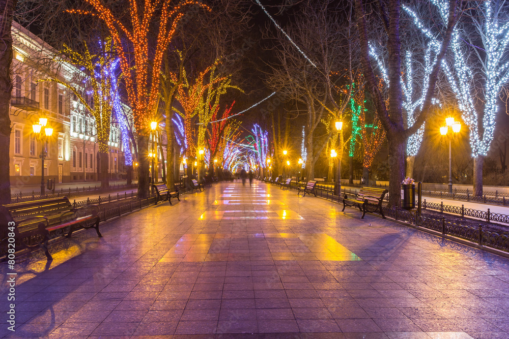 Lights and benches at night alley in Odessa, Ukraine