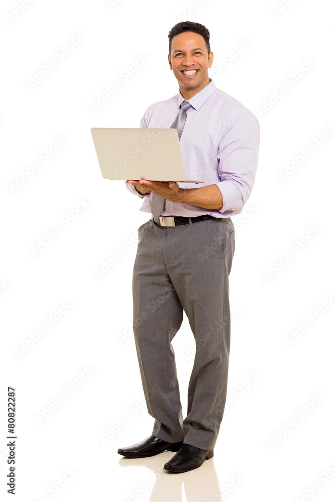 middle aged corporate worker holding laptop