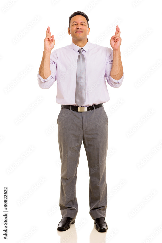 mid age man with fingers crossed mid age man with fingers crossed