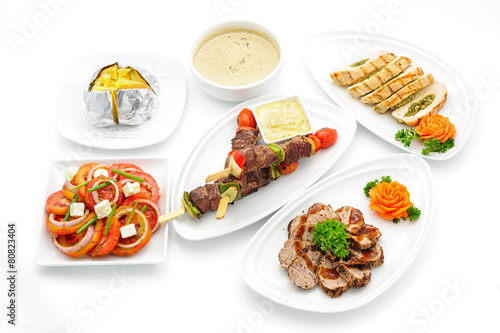 Set of international dishes arranged for catering, studio shot