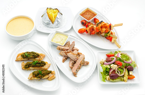 Set of international dishes arranged for catering, studio shot