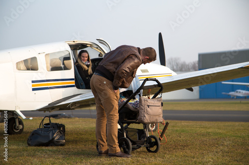 Happy family with child before flight.