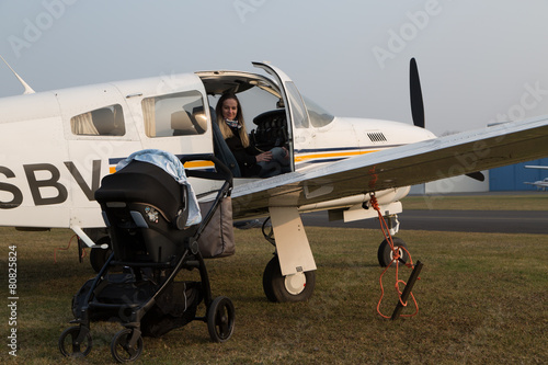 mother pilot prepares her flight. photo