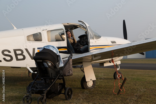 mother pilot prepares her flight. photo