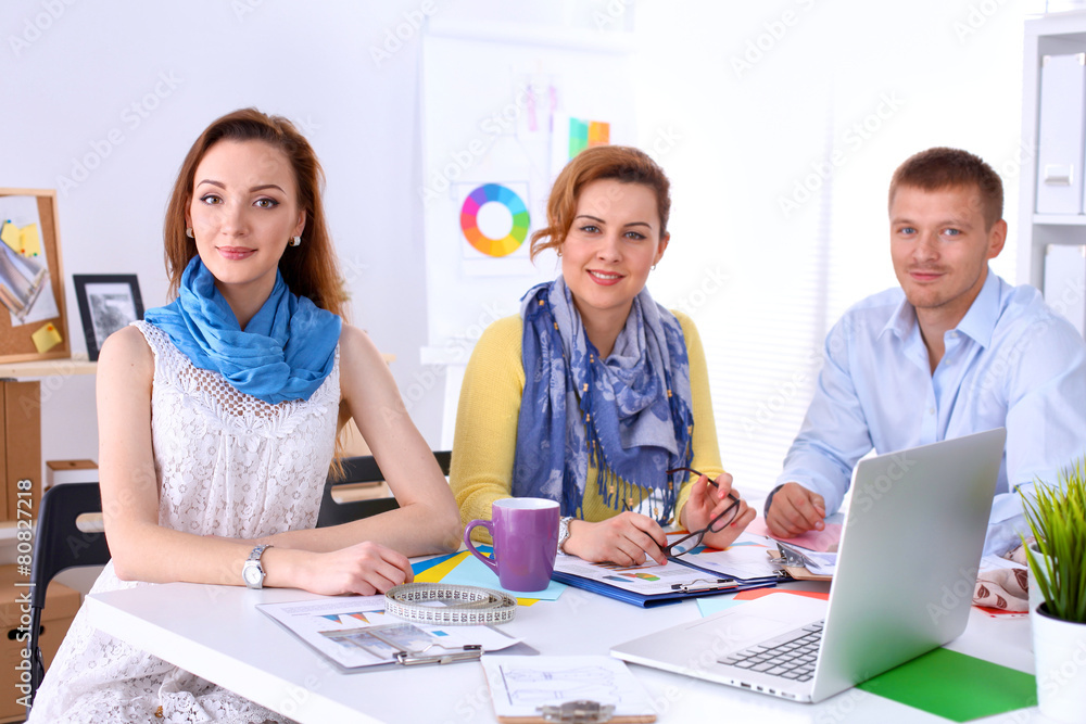 Young business people working at office on new project Young business people working at office on new project