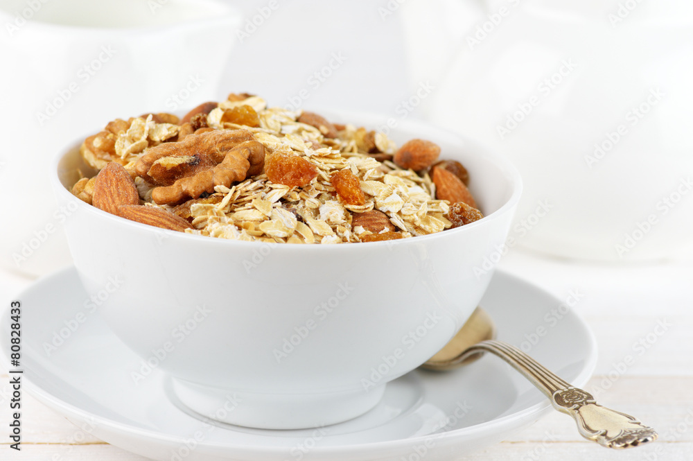 Oatmeal flakes with nuts in bowl Oatmeal flakes with nuts in bowl