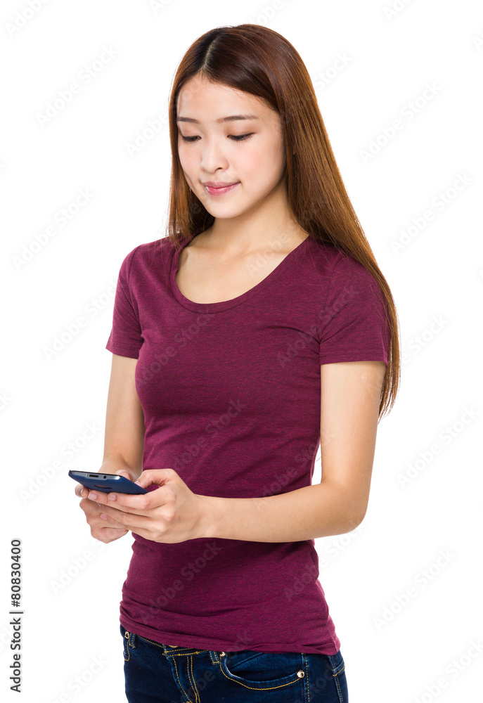 Asian girl receiving text message Asian girl receiving text message