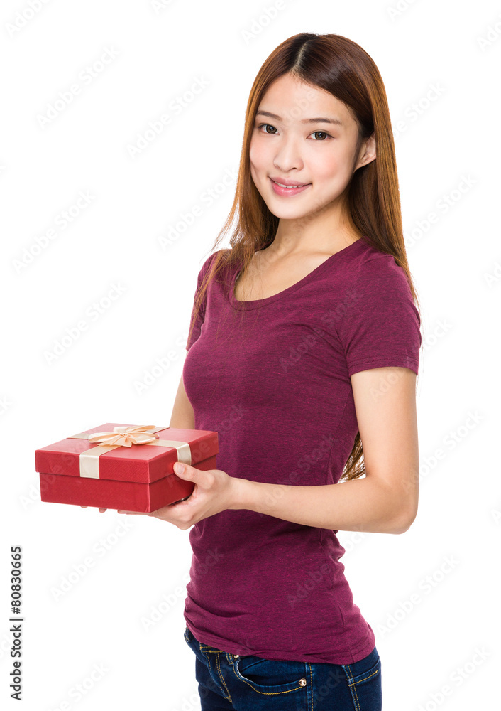 Beautiful woman smiling and holding gift box Beautiful woman smiling and holding gift box