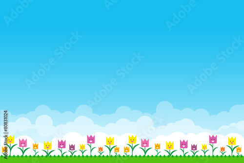 Nature background with green grass and smile flowers and blue sk