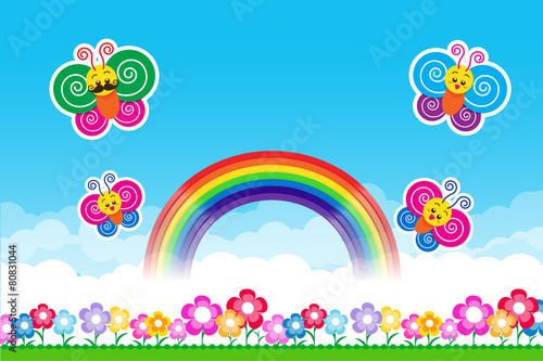 Butterfly Rainbow on Nature background with green grass and flo