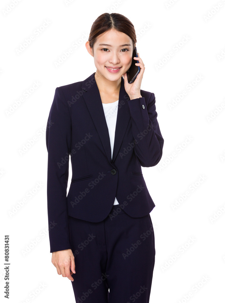 Asian businesswoman talking by cellphone Asian businesswoman talking by cellphone