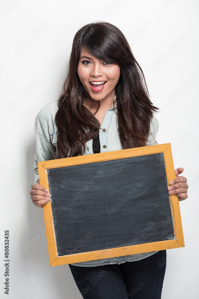  young asian woman holding blank black board