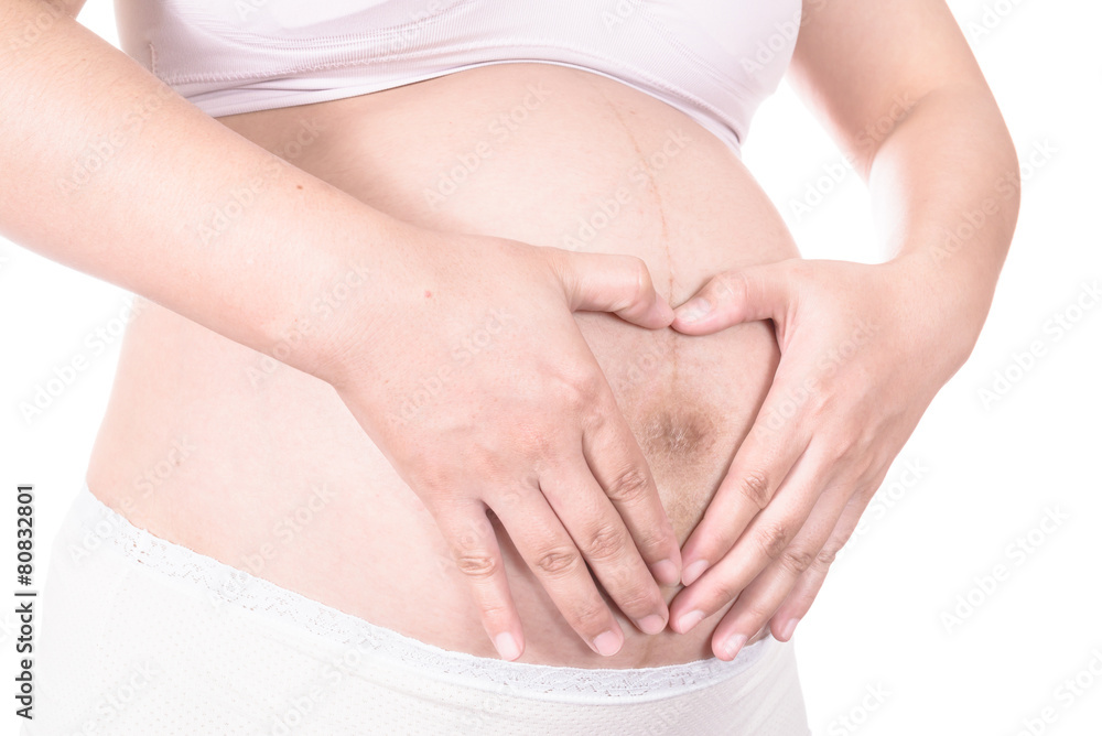 Loving couple with hands around pregnant belly Loving couple with hands around pregnant belly