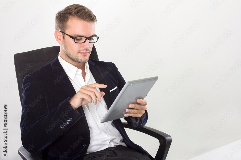 Young businessman with a tablet on his hand Young businessman with a tablet on his hand