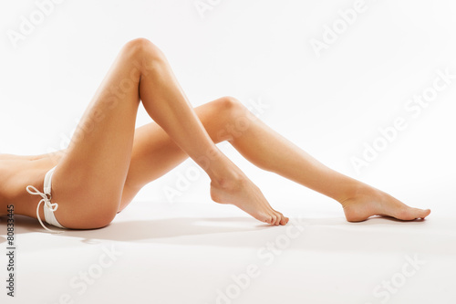 Perfect female legs  isolated on white background