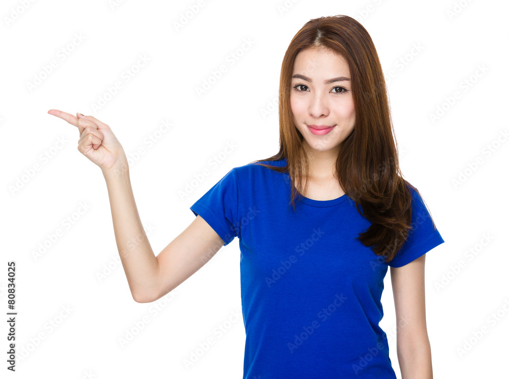 Asian woman pointing to empty space Asian woman pointing to empty space