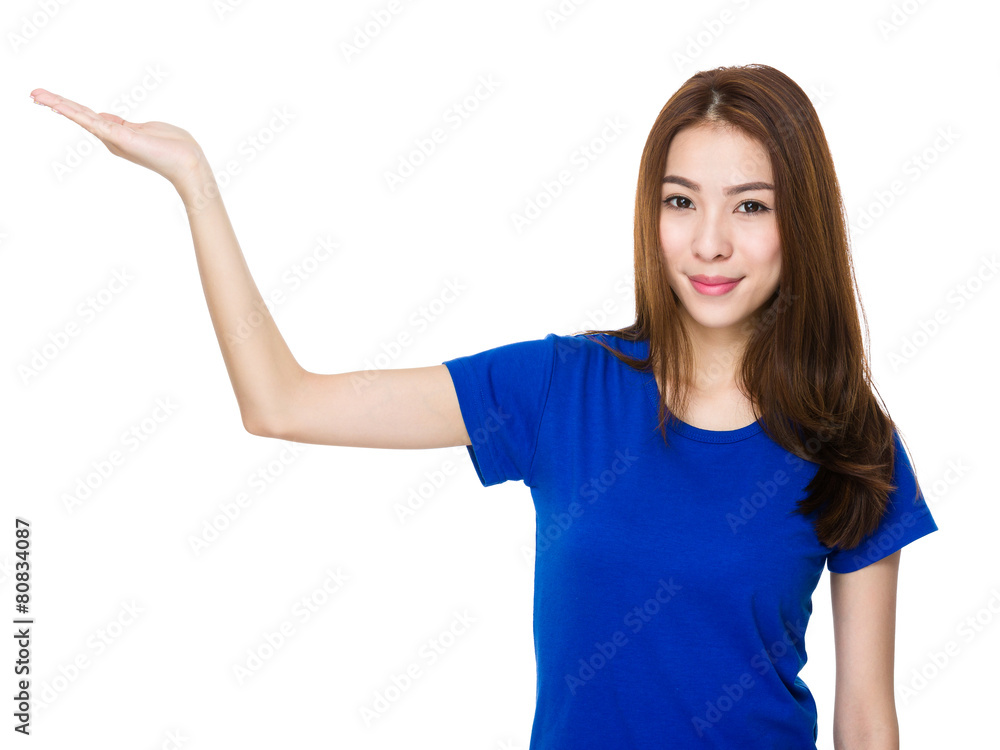 Smiling woman showing copy space for product Smiling woman showing copy space for product