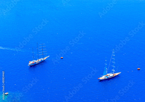 2 big sailing boats under Fira of Santorini island in Greece © imagIN photography