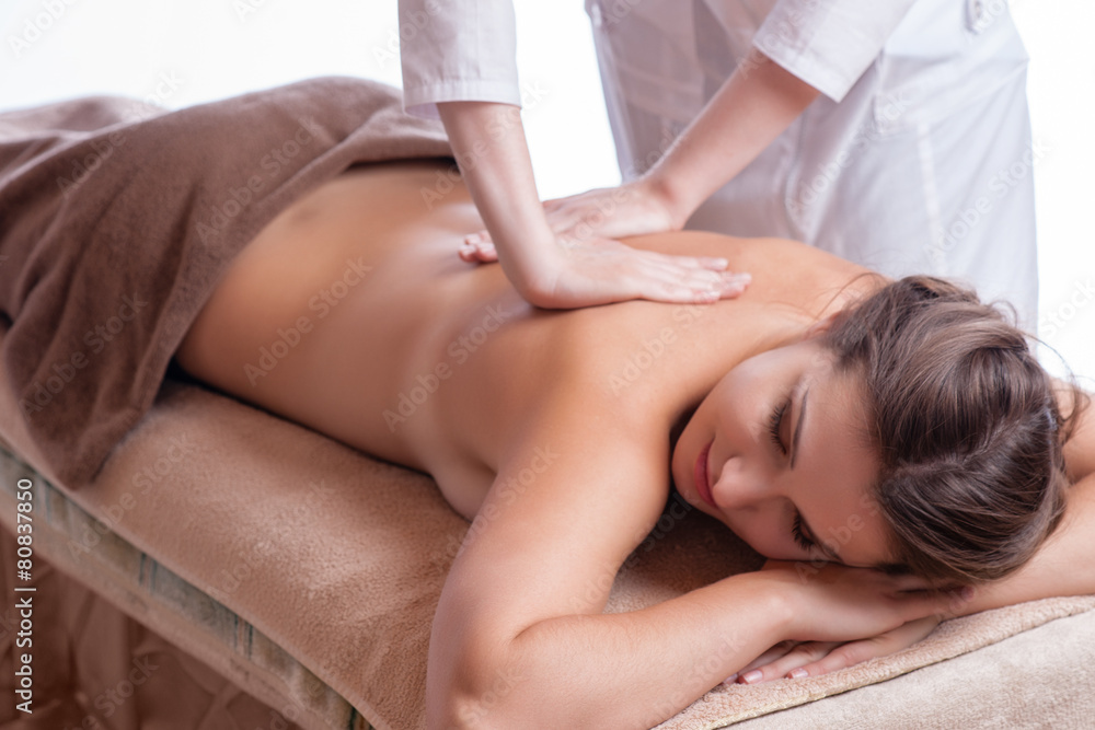 Obraz premium Masseur doing massage on woman body in the spa salon. 