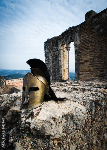 Spartan helmet on castle ruins