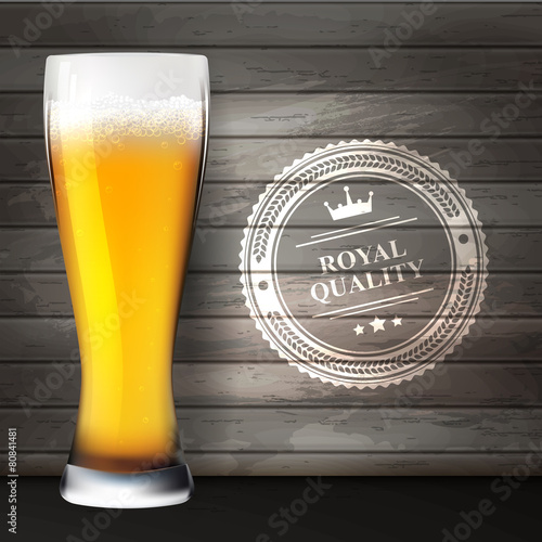 Glass of beer on wooden surfaces.