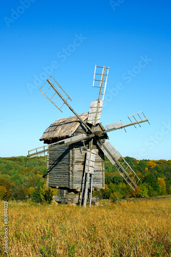 Old wooden windmills at autumn season