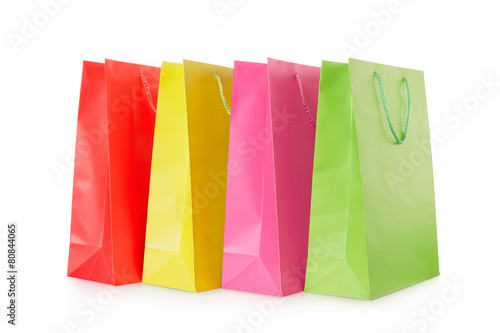 Colorful shopping bags in paper on white, clipping path