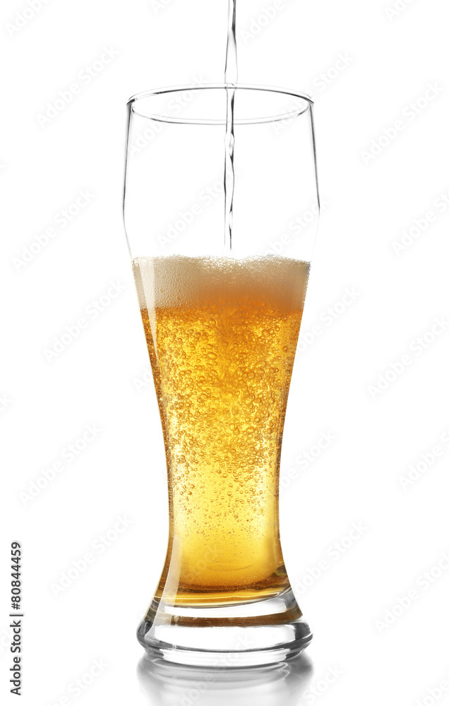 Pouring beer into glass isolated on white Pouring beer into glass isolated on white