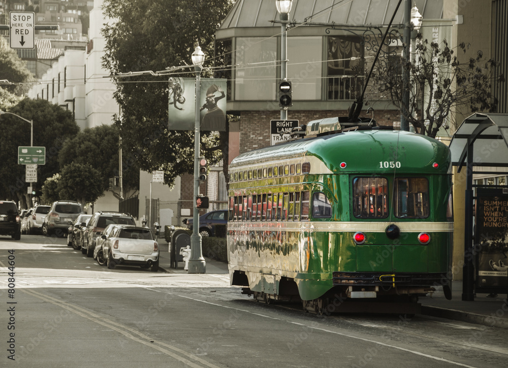 Vintage Overhead Cable Retro Trolley Car moves through street