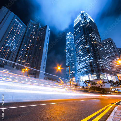 Photography Busy traffic light trails and office buildings.