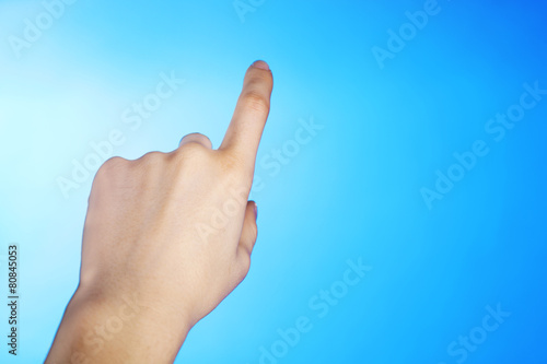 Female hand on colorful background