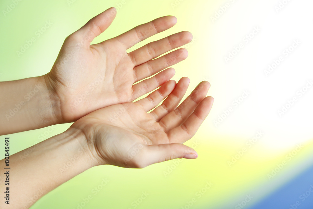 Female hand on colorful background Female hand on colorful background